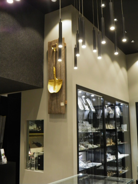 Peter's  Golden Shovel hanging in the Minshaft Canberra Shop